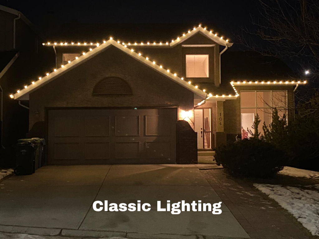 Classic holiday lighting on a suburban home in Calgary with warm-white roofline LEDs and a simple, elegant design installed by Knight Illumination.